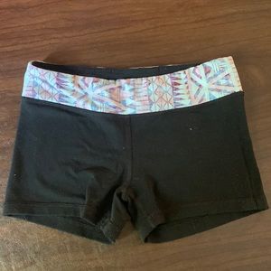 Athletic black yoga shorts from Ivivva with reversible colorful band.